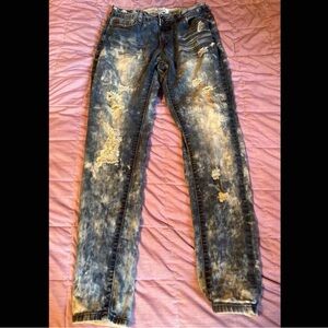 acid washed dark blue ripped jeans